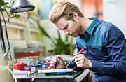 Man Working on Electronic Repair