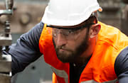 Man Pushing Working With Industrial Machine