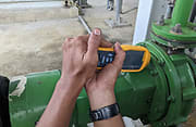 Man testing vibration on machine
